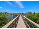 Scenic view of a private boat dock on a canal, perfect for waterfront living and boating enthusiasts at 10930 Spring St, Largo, FL 33774