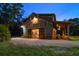 Charming barn-style home with a spacious front porch, and sliding barn doors, set against a serene landscape at 10930 Spring St, Largo, FL 33774