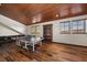 Spacious game room with wooden floors, ping pong table and window views at 10930 Spring St, Largo, FL 33774