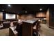 Enjoy movies in this home theater with leather recliners, a bar, and a projector system for the ultimate viewing experience at 10930 Spring St, Largo, FL 33774