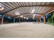Spacious indoor riding arena with excellent lighting and footing for equestrian activities at 10930 Spring St, Largo, FL 33774