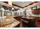 A gourmet kitchen features two islands, pendant lights, and stainless steel appliances at 10930 Spring St, Largo, FL 33774