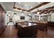 Gourmet kitchen with an island, granite countertops, stainless steel appliances, and dark wood cabinets at 10930 Spring St, Largo, FL 33774