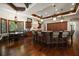 Gourmet kitchen features an island, stainless steel appliances, granite countertops, and hardwood floors at 10930 Spring St, Largo, FL 33774