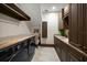 Functional laundry room featuring granite countertops, modern washer and dryer, and ample storage space at 10930 Spring St, Largo, FL 33774