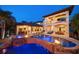 A stunning pool area with a waterfall, spa, outdoor kitchen, and covered patio, perfect for entertaining at 10930 Spring St, Largo, FL 33774