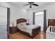 Traditional bedroom with hardwood floors, featuring a comfortable bed, and bedside table at 11008 Nest Ct, Odessa, FL 33556