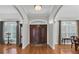 Spacious foyer featuring hardwood floors and an elegant double-door entrance at 11008 Nest Ct, Odessa, FL 33556