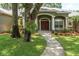 Inviting front view showcasing the home's entrance, complemented by lush landscaping at 11008 Nest Ct, Odessa, FL 33556
