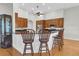 Open-concept kitchen featuring barstool seating at the breakfast bar and stainless steel appliances at 11008 Nest Ct, Odessa, FL 33556