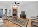 Inviting living room showcasing a brick fireplace and comfortable seating arrangements at 11008 Nest Ct, Odessa, FL 33556