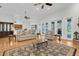 Spacious living room flowing into the kitchen with ample seating and natural light at 11008 Nest Ct, Odessa, FL 33556