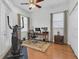 Home office space with hardwood floors, featuring a desk with dual monitors and an exercise bike at 11008 Nest Ct, Odessa, FL 33556