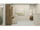 Bright office space featuring a wooden desk, shelves, artwork, and a view to the bedroom at 11071 E 65Th Ter, Palmetto, FL 34221