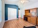 Cozy bedroom with hardwood floors, built-in desk, and bright window at 11362 Heritage Way, Largo, FL 33778