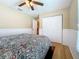 Cozy bedroom features a ceiling fan, a closet, and neutral wall paint at 11362 Heritage Way, Largo, FL 33778