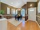 Formal dining room with hardwood floors, decorative lighting, and elegant wall trim details at 11362 Heritage Way, Largo, FL 33778