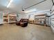 Spacious garage with a seating area, workbench, and ample storage at 11362 Heritage Way, Largo, FL 33778