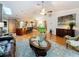Spacious open-concept with hardwood floors, comfortable seating, and bright light at 11362 Heritage Way, Largo, FL 33778