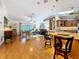 Open-concept living space with hardwood floors, modern decor, and a seamless flow between rooms at 11362 Heritage Way, Largo, FL 33778