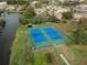Aerial view of community tennis courts at 11439 Golf Round Dr, New Port Richey, FL 34654