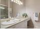 Bathroom featuring a large mirror, vanity, and shower at 11439 Golf Round Dr, New Port Richey, FL 34654