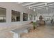 Inviting community entrance featuring a serene fountain, comfortable seating, and well-maintained landscaping at 11439 Golf Round Dr, New Port Richey, FL 34654