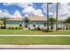 Charming single-story home with lush green lawn and well-maintained landscaping at 11439 Golf Round Dr, New Port Richey, FL 34654