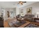Spacious living room with hardwood flooring, neutral walls, and views into the foyer at 11439 Golf Round Dr, New Port Richey, FL 34654