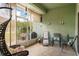 Relaxing sunroom with comfortable seating at 11439 Golf Round Dr, New Port Richey, FL 34654