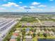Aerial view showcasing the neighborhood's proximity to Tampa Bay, lush greenery, and well-kept homes at 11830 Autumn Creek Dr, Riverview, FL 33569