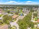 Beautiful lakefront homes with lush trees and landscaping are featured in this aerial view at 11830 Autumn Creek Dr, Riverview, FL 33569