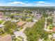 Beautiful lakefront homes with lush trees and landscaping are featured in this aerial view at 11830 Autumn Creek Dr, Riverview, FL 33569