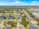 Aerial view of a neighborhood featuring ponds, mature trees, and well-maintained homes at 11830 Autumn Creek Dr, Riverview, FL 33569