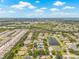 A lovely neighborhood, complete with a pond, is captured in this aerial shot on a sunny day at 11830 Autumn Creek Dr, Riverview, FL 33569