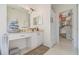 Bathroom with a vanity area, a walk-in closet with ample storage space, and neutral tile flooring at 11830 Autumn Creek Dr, Riverview, FL 33569
