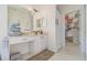 Bright bathroom with vanity, storage, and a closet with plenty of storage for clothes at 11830 Autumn Creek Dr, Riverview, FL 33569