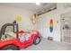 Bedroom with a Jeep bed, cute surfboard art, and decor provides a cheerful space at 11830 Autumn Creek Dr, Riverview, FL 33569