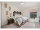 Comfortable bedroom with carpet, a decorative headboard, and a window that provides natural light at 11830 Autumn Creek Dr, Riverview, FL 33569