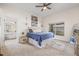 Cozy bedroom with carpet, a comfortable bed, a window providing natural light, and a connecting bathroom at 11830 Autumn Creek Dr, Riverview, FL 33569