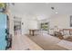 Spacious dining room with a large wooden table, white chairs, and a bright window at 11830 Autumn Creek Dr, Riverview, FL 33569
