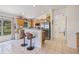 Open-plan kitchen featuring wooden cabinets, stainless steel appliances, and breakfast bar with stylish seating at 11830 Autumn Creek Dr, Riverview, FL 33569
