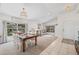 Bright open-concept living area with dining table, sofa, and ample natural light at 11830 Autumn Creek Dr, Riverview, FL 33569