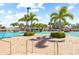 Community pool with multiple lounge areas, lush greenery and a shallow splash-pool entry at 11830 Autumn Creek Dr, Riverview, FL 33569