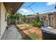 Spacious backyard with a brick patio area, fenced for privacy, and ready for landscaping at 1213 Cuttingin Pl, Tampa, FL 33612