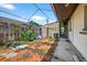 Cozy backyard featuring a brick patio area and some greenery, perfect for outdoor relaxation at 1213 Cuttingin Pl, Tampa, FL 33612