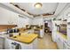Kitchen with wood countertops, white cabinetry, and vintage decor at 1213 Cuttingin Pl, Tampa, FL 33612