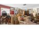 Cluttered living room featuring dark red accent wall and various furniture pieces at 1213 Cuttingin Pl, Tampa, FL 33612