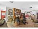 Open living room with vintage decor and carpeted flooring at 1213 Cuttingin Pl, Tampa, FL 33612