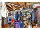 Inside the storage room, showing the wood slat roof, storage racks and some personal items at 1213 Cuttingin Pl, Tampa, FL 33612